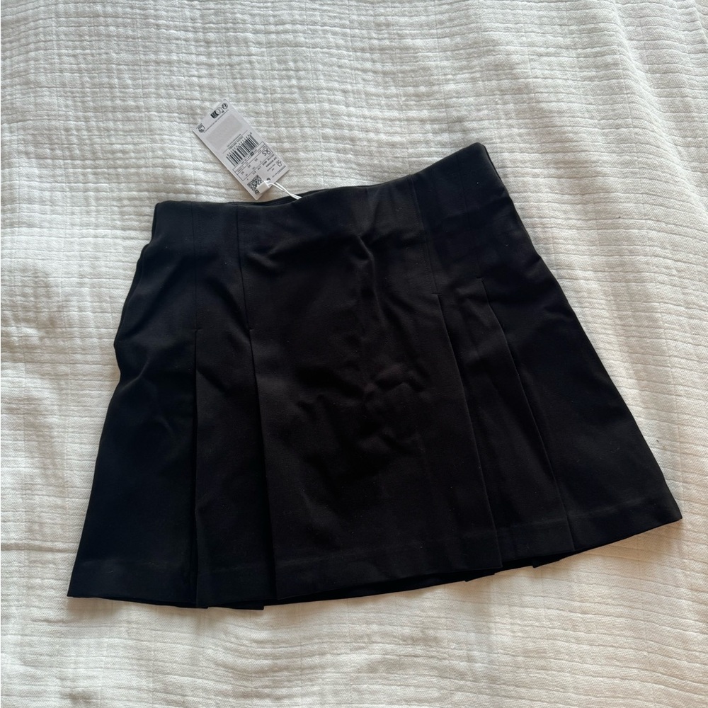 Black pleat mini skirt. NWT